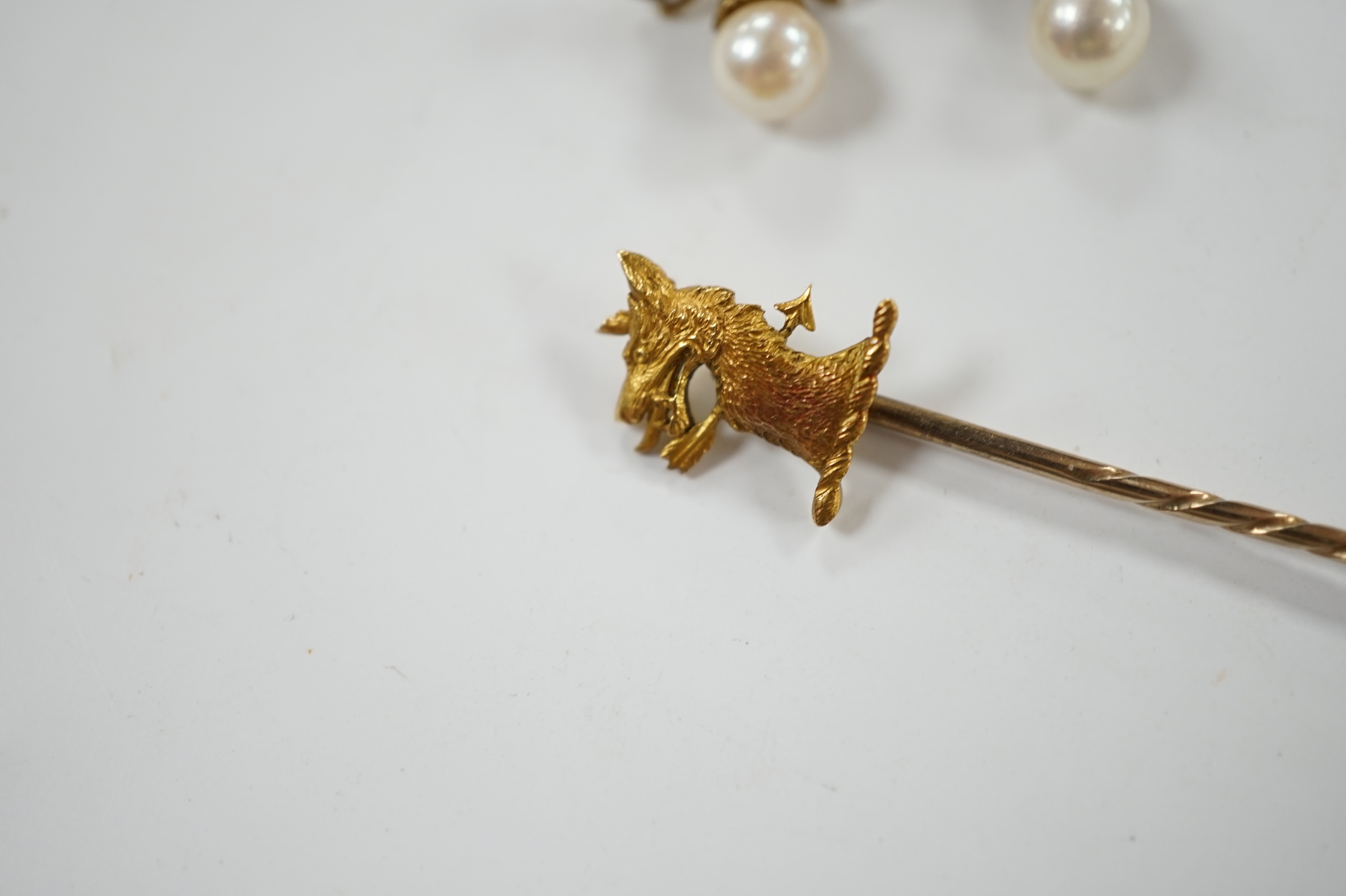 A pair of 9ct, single stone cultured pearl and seed pearl cluster set 'ribbon bow' drop ear studs, 17mm, together with a yellow metal 'armorial' stick pin. Condition - fair to good